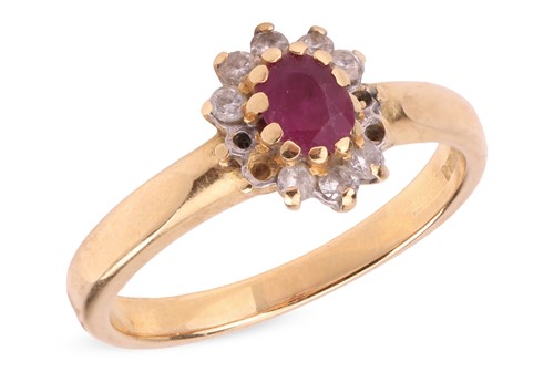 Lot 38 - A ruby and diamond cluster ring, comprising a...