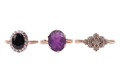 Lot 32 - A single stone oval amethyst dress ring,...