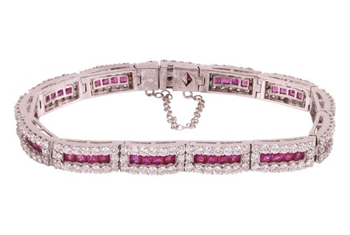 Lot A ruby and diamond line bracelet, each hinged...