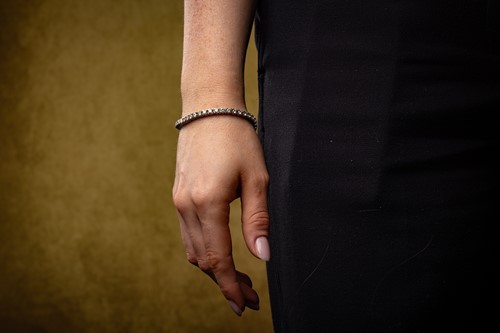 Lot 58 - A diamond-set tennis bracelet, set with...