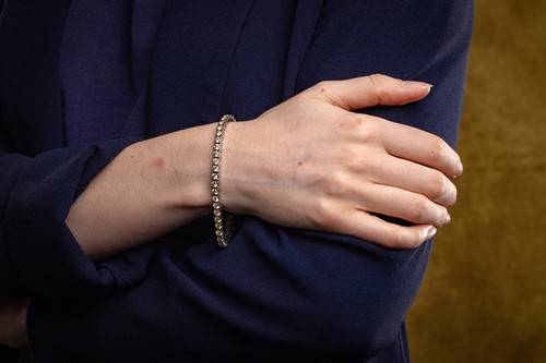 Lot 58 - A diamond-set tennis bracelet, set with...