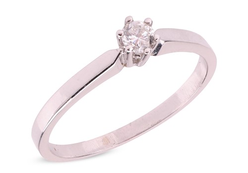 Lot A diamond solitaire ring, claw-set with a...