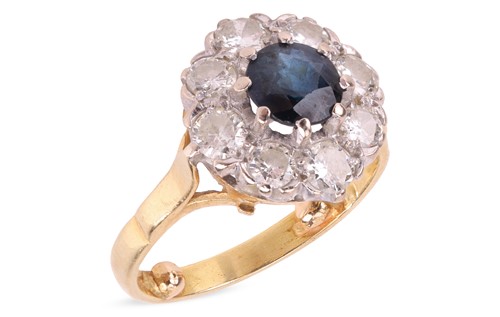 Lot A sapphire and diamond cluster ring in 18ct...
