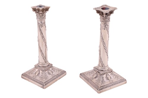 Lot 282 - A pair of late Victorian column candlesticks,...
