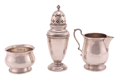 Lot A silver sugar caster, of panelled circular...
