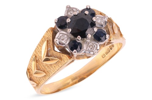 Lot A sapphire and diamond cluster ring in 18ct...