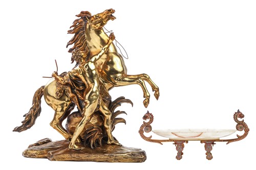 Lot After Cousteau, a gilt bronze figure of the...