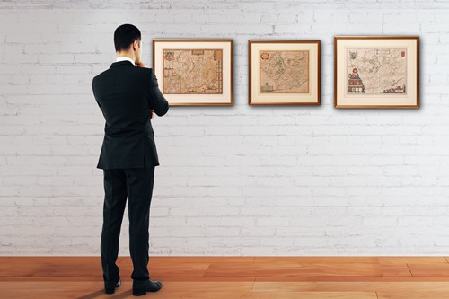 Lot 55 - A group of three hand-tinted maps of...