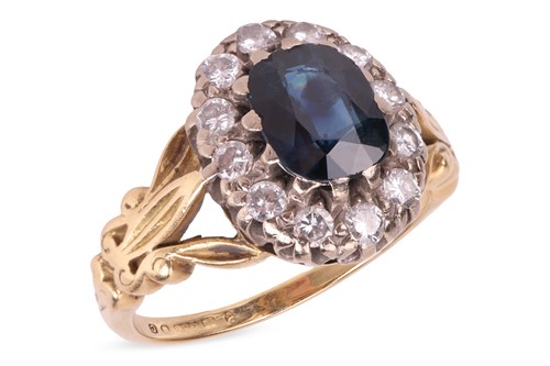 Lot A sapphire and diamond halo ring in 18ct gold,...