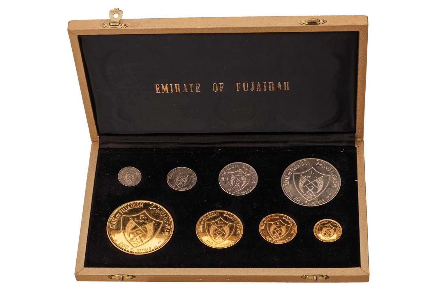 Lot A collection of eight State of Fujairah...