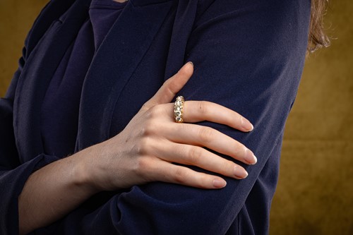 Lot A diamond-set half hoop ring, set with five...