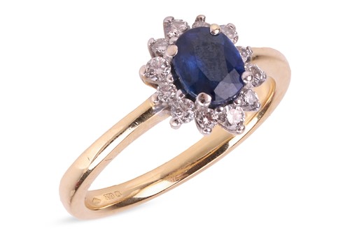 Lot A sapphire and diamond-set ring, centrally-set...