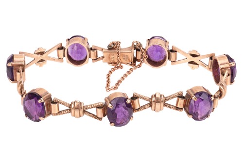 Lot A fancy link bracelet set with amethyst in 9ct...