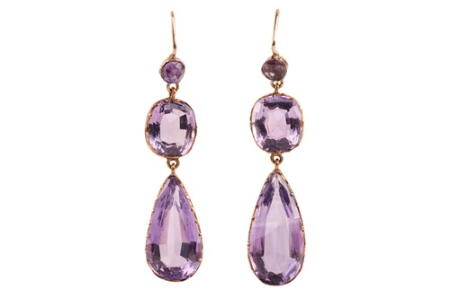 Lot 4 - A pair of amethyst pendant earrings; the...