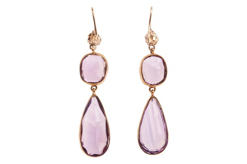 Lot 4 - A pair of amethyst pendant earrings; the...