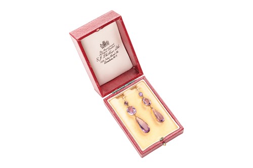 Lot 4 - A pair of amethyst pendant earrings; the...