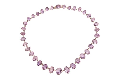 Lot 5 - An amethyst riviere necklace; the row of 36...