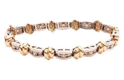 Lot A two-tone diamond-set line bracelet, with an...