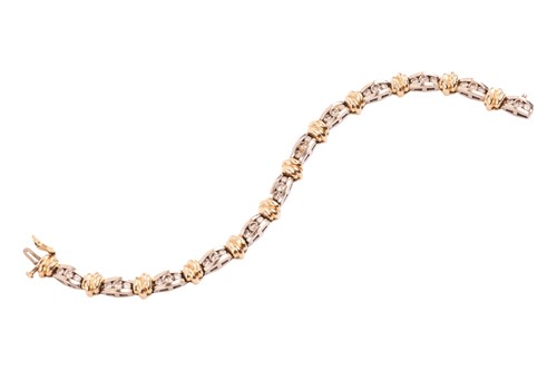 Lot A two-tone diamond-set line bracelet, with an...