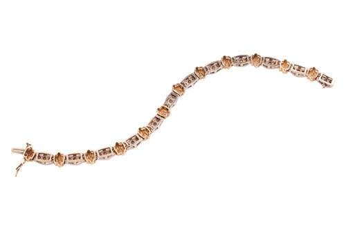 Lot A two-tone diamond-set line bracelet, with an...