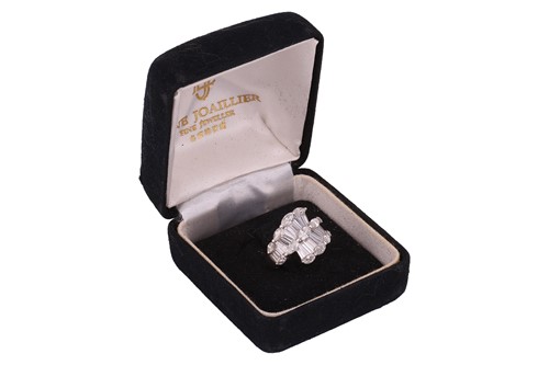 Lot A diamond cluster crossover ring, with an...