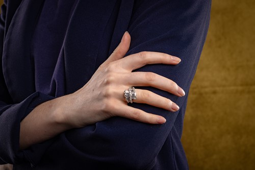 Lot A diamond cluster crossover ring, with an...