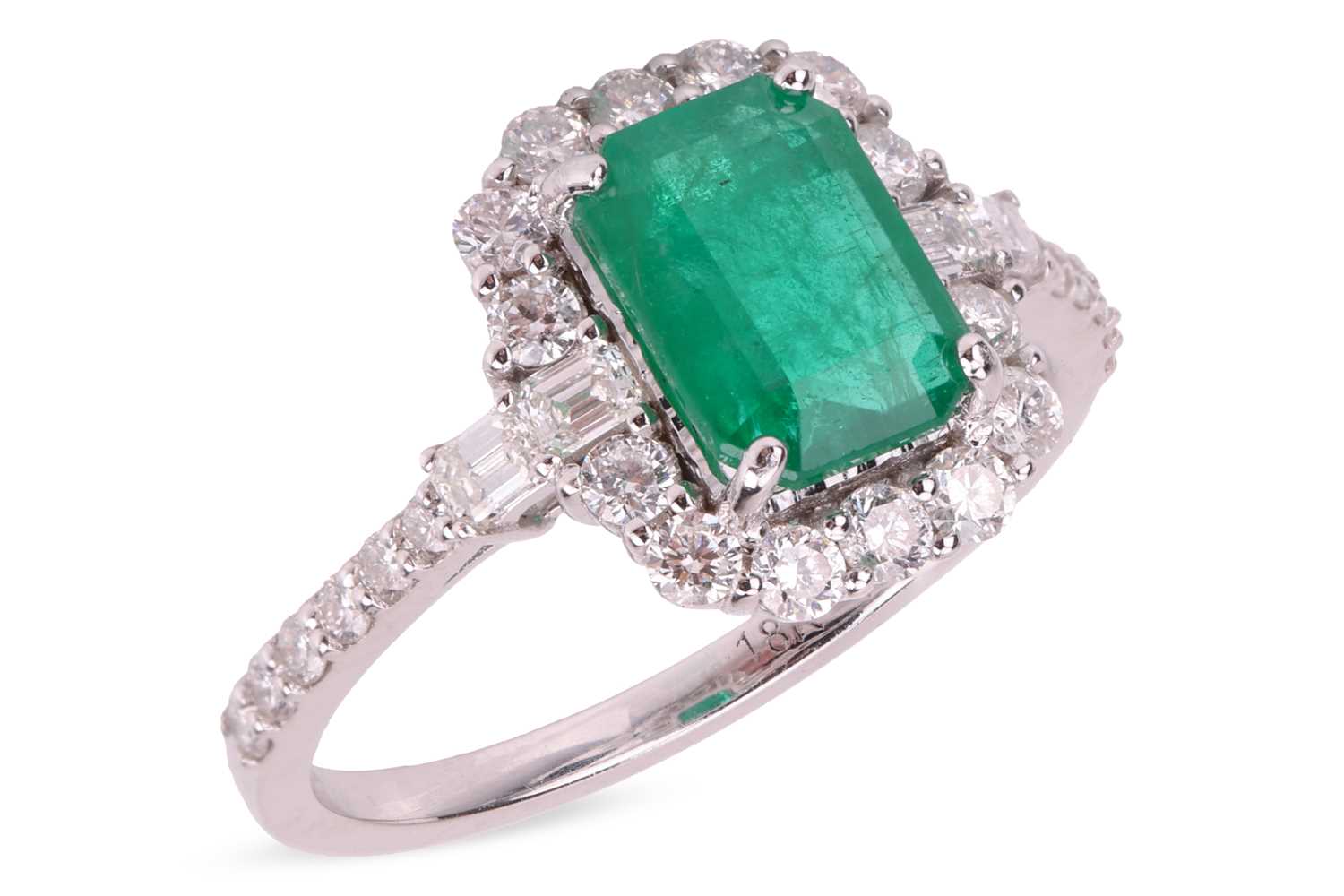 Lot An emerald and diamond-set cluster ring,...