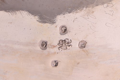 Lot 289 - A heavy-gauge Irish silver two-piece tea set,...