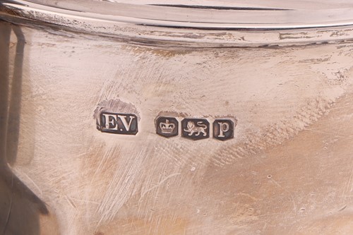 Lot A silver three-piece tea set with a matched...