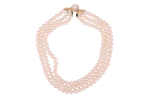 Lot A three-row cultured pearl necklace,...