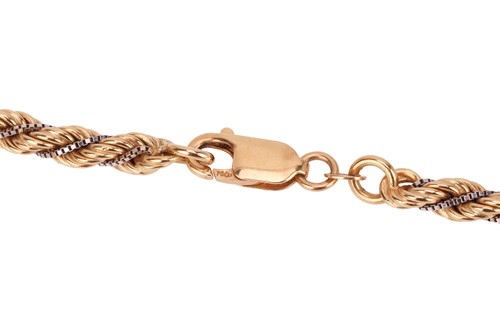 Lot 99 - A two-toned twisted rope necklace, accented...