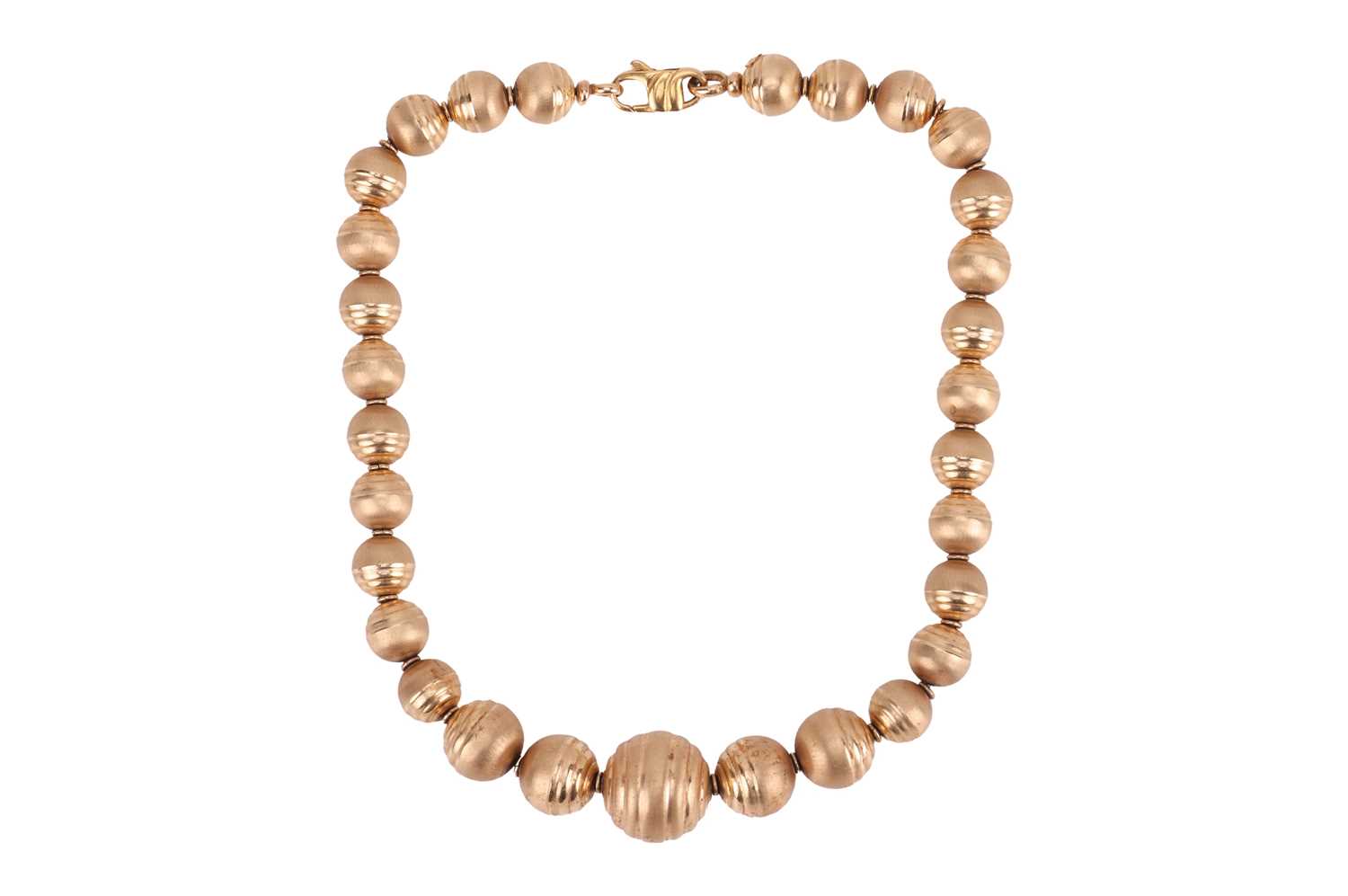 Lot A textured bead necklace, featuring graduated...