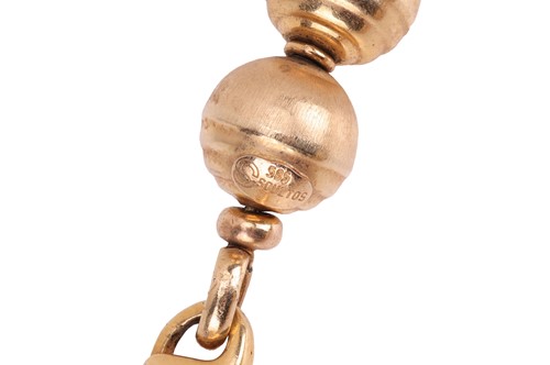 Lot A textured bead necklace, featuring graduated...