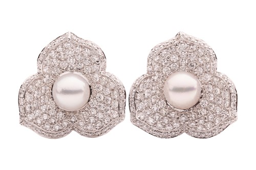 Lot A pair of diamond and cultured pearl earrings,...
