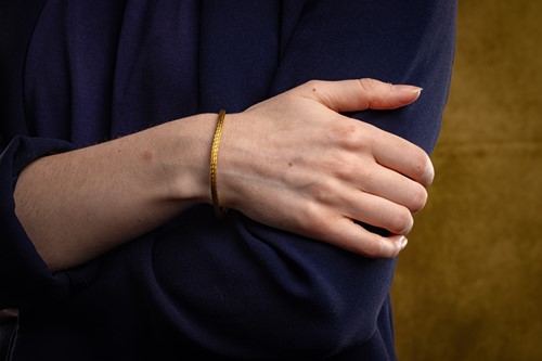 Lot 94 - Ilias Lalaounis - a woven mesh bracelet, the...
