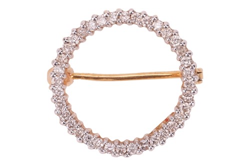Lot A diamond-set open circle brooch, claw-set...