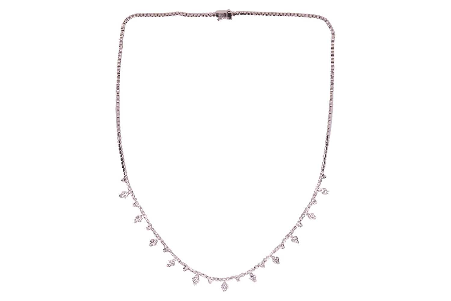 Lot A diamond-set fringe necklace, composed of...