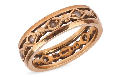 Lot 151 - A pierced ring band in 18ct gold, with lozenge-...