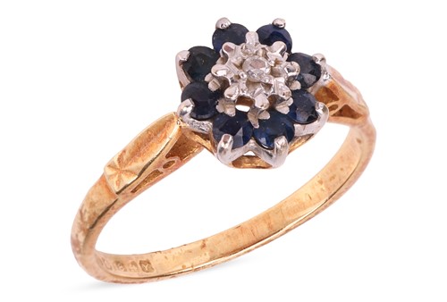 Lot A sapphire and diamond cluster ring in 18ct...