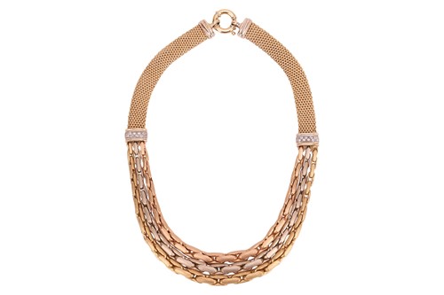 Lot A three-tone fancy chain necklace, comprising...