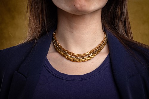 Lot A three-tone fancy chain necklace, comprising...