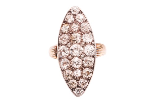 Lot 8 - A diamond set dress ring; the navette-shaped...