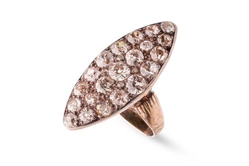 Lot 8 - A diamond set dress ring; the navette-shaped...