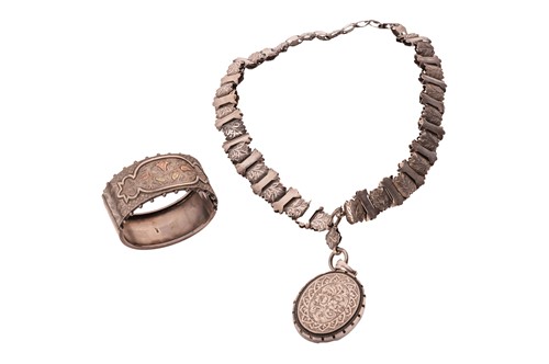 Lot 17 - A Victorian silver necklace and bangle. The...