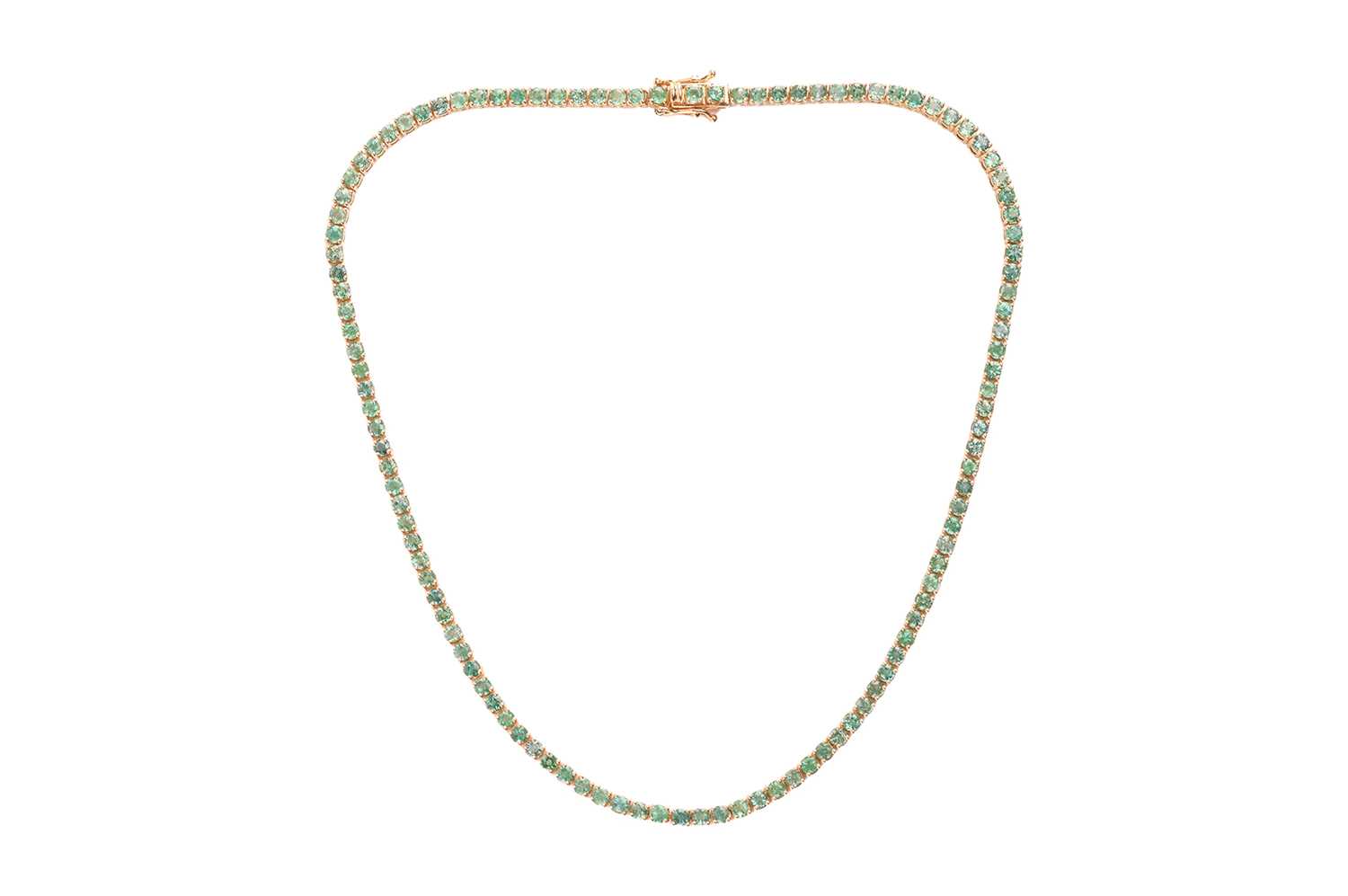 Lot An emerald line necklace, comprising a series...