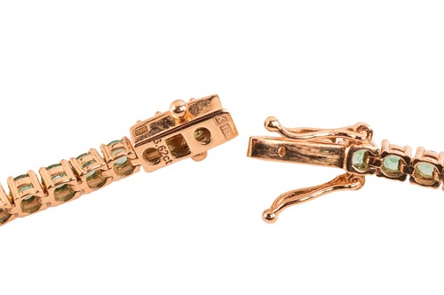 Lot An emerald line necklace, comprising a series...