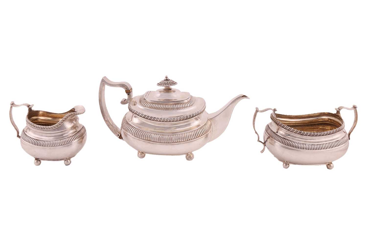 Lot 263 - A George III silver three-piece tea service,...