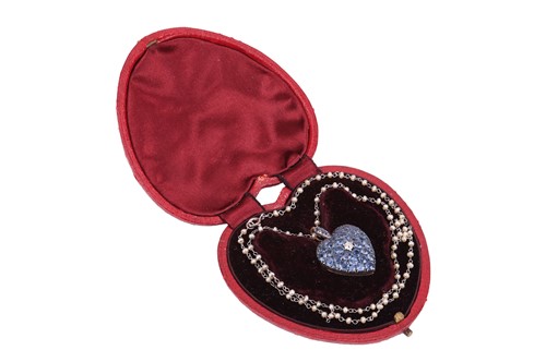 Lot 25 - A heart locket pendant on chain set with...