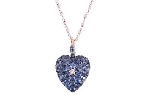 Lot 25 - A heart locket pendant on chain set with...