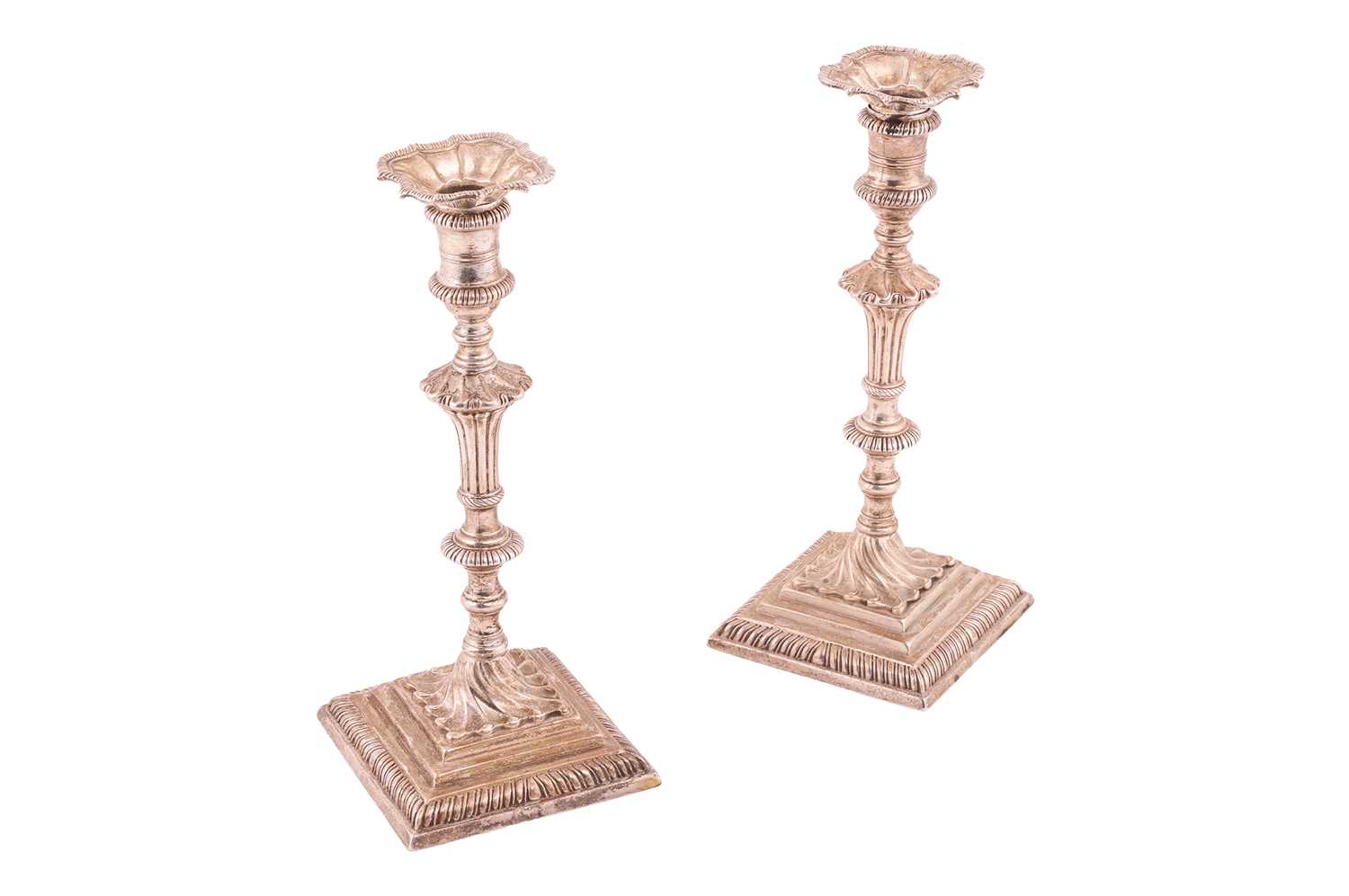 Lot 288 - A pair of George III cast silver candlesticks,...